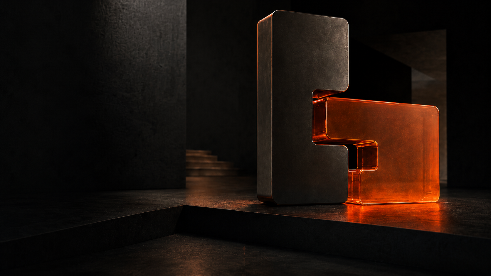 Sculptural black and glowing amber glass bricks in a dark concrete studio